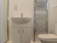 a bathroom with a sink and a toilet at Mews House in Camborne