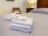 A bed or beds in a room at Le Casette di Piazza Borsa
