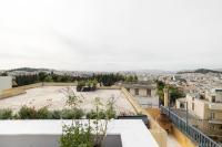 Nespecifikovaný výhled na destinaci Atény nebo výhled na město při pohledu z apartmánu