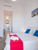 A bed or beds in a room at Apartamentos Alcazaba
