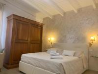 A bed or beds in a room at Alghero Roof Garden