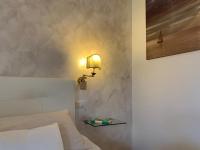 A bed or beds in a room at Alghero Roof Garden