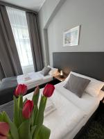 Postel nebo postele na pokoji v ubytování Hotel Boston