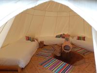 a room with three beds in a tent at L&#39;Escale des Châteaux de la Loire in Angé
