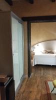 Postel nebo postele na pokoji v ubytování Posada Real de Las Misas