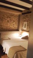 Postel nebo postele na pokoji v ubytování Posada Real de Las Misas