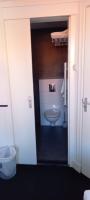 a bathroom with a toilet and a sink at Stad &amp; Strandhotel Elisabeth in Vlissingen