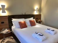 Łóżko lub łóżka w pokoju w obiekcie Best Western Hotel City