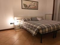 A bed or beds in a room at Casa di Gabry
