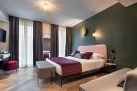 A bed or beds in a room at Hotel Forte del 48