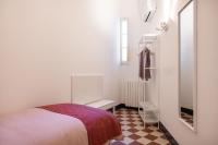 A bed or beds in a room at Casa Rorro' nei pressi di Via Roma by Wonderful Italy