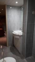 a bathroom with a sink and a shower at La maison du pêcheur in Livinhac-le-Haut