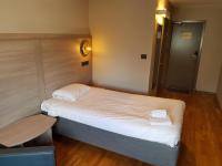 Postel nebo postele na pokoji v ubytování Hotell Stinsen