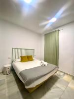 Posteľ alebo postele v izbe v ubytovaní Apartamentos - Alameda