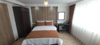 Cama o camas de una habitaci&oacute;n en HOTEL GLOBAL 2022