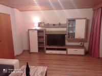 Televízia a/alebo spoločenská miestnosť v ubytovaní Haus Sonnenschein