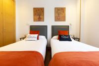 A bed or beds in a room at Unamuno by Bilbao Living