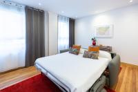 A bed or beds in a room at Unamuno by Bilbao Living