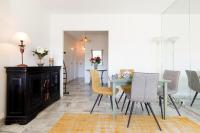 a dining room with a table and chairs at ELEGANCE YourHostHelper in Le Cannet