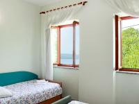Postel nebo postele na pokoji v ubytování Holiday Home Petra by Interhome