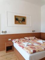 Postel nebo postele na pokoji v ubytování Hotel Morava