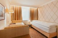 Postel nebo postele na pokoji v ubytování Hotel Scherer