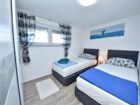 Posteľ alebo postele v izbe v ubytovaní Holiday Home Tina & Tino by Interhome