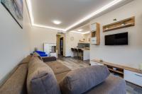 Televízia a/alebo spoločenská miestnosť v ubytovaní Forest Földvár Apartmanok By BLTN