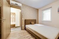 Posteľ alebo postele v izbe v ubytovaní Forest Földvár Apartmanok By BLTN