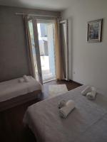 Posteľ alebo postele v izbe v ubytovaní Apartments Lalic