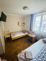 Postel nebo postele na pokoji v ubytování Hotel Pod Zámkem