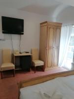 Televízia a/alebo spoločenská miestnosť v ubytovaní Hotel Garny Pleso