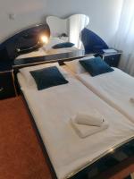 Posteľ alebo postele v izbe v ubytovaní Hotel Garny Pleso