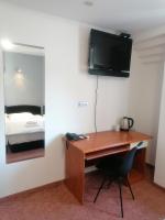 Televízia a/alebo spoločenská miestnosť v ubytovaní Hotel Garny Pleso