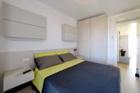 A bed or beds in a room at Residence Colorado Deluxe