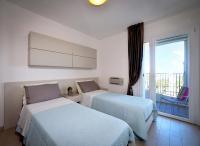 A bed or beds in a room at Residence Colorado Deluxe