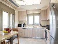 Kuchyňa alebo kuchynka v ubytovaní Utopia Luxury Villas