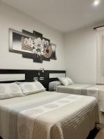 Postel nebo postele na pokoji v ubytování Hotel Daymiel