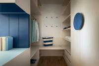 a walk in closet with blue and white cabinets at Falkensteiner Family Hotel Diadora in Zadar