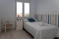 Postel nebo postele na pokoji v ubytování Bonita vivenda con jardín en playa Aguieira