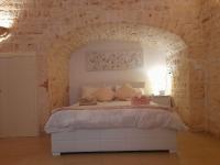 A bed or beds in a room at Dimora Morello