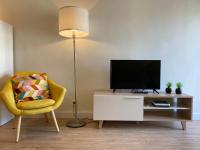 A television and/or entertainment centre at Xuloss Apartments 2