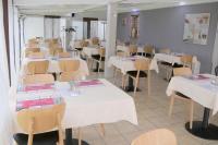 En restaurang eller annat matst&auml;lle p&aring; H&ocirc;tel Restaurant du Lac