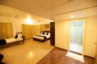 Hotel Guruvayur Darshanにあるベッド