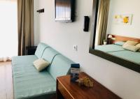 Łóżko lub łóżka w pokoju w obiekcie Hotel Sur