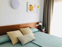 Łóżko lub łóżka w pokoju w obiekcie Hotel Sur