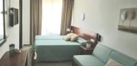 Łóżko lub łóżka w pokoju w obiekcie Hotel Sur