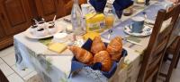 a table with a table cloth with a table with bread at L Imperatrice in Berck-sur-Mer