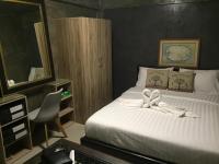 Postel nebo postele na pokoji v ubytování Loft 21 Apartment Romklao