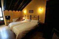 Hotel Rural Casa Cuetoにあるベッド